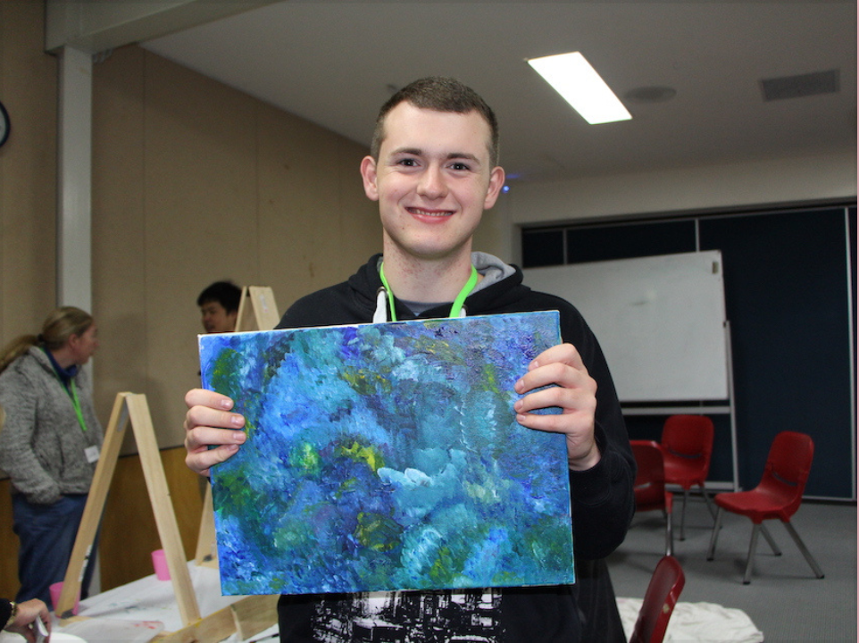 Taylor a member of Jesus Club Castle Hill showcasing his painting